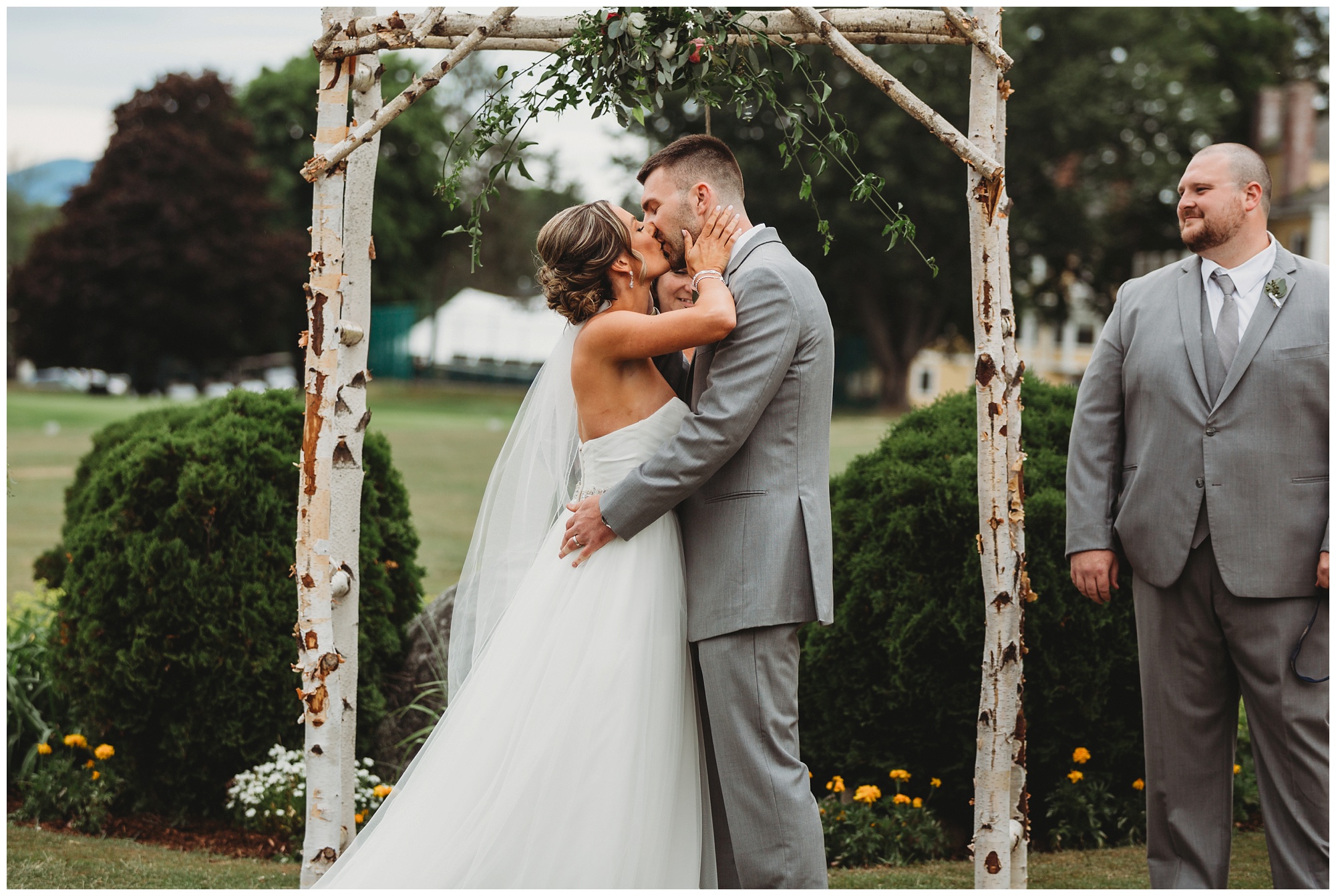 Bride and groom share first kiss at Bethel Inn Resort.