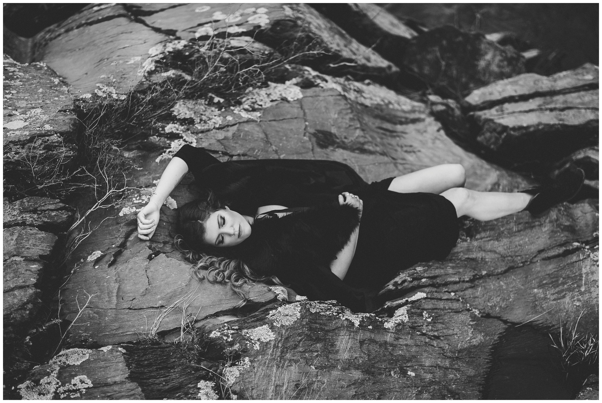girl laying on rock